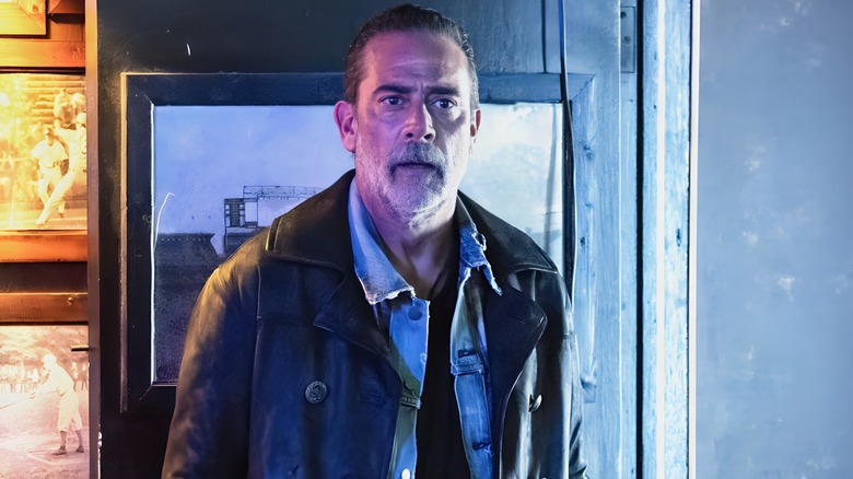 Negan standing in a doorway 