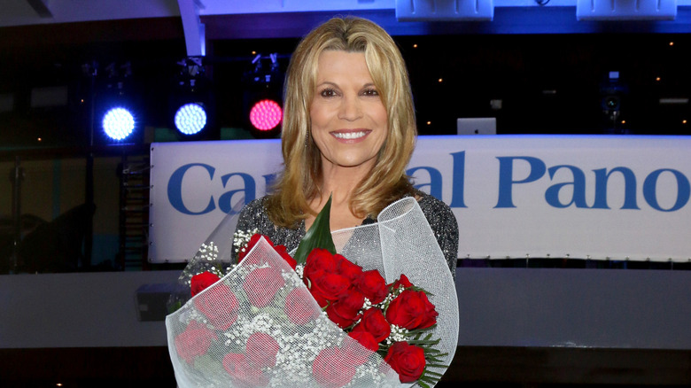 Vanna White holding a bouquet of flowers