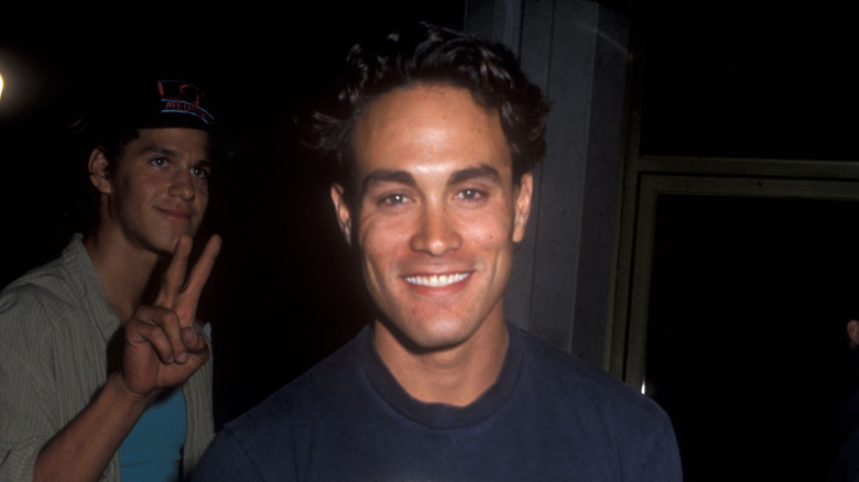 Brandon Lee posting with a friend