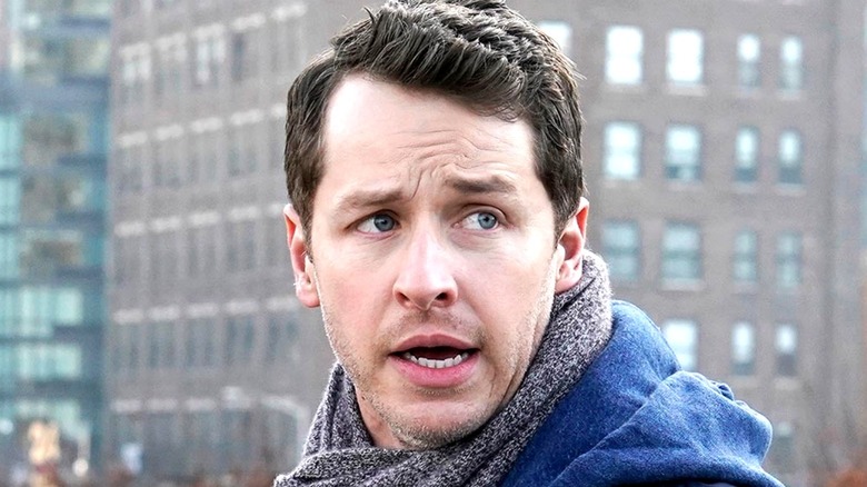 Ben wearing a scarf and looking away