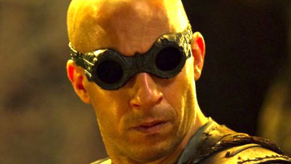 Riddick looking back in goggles