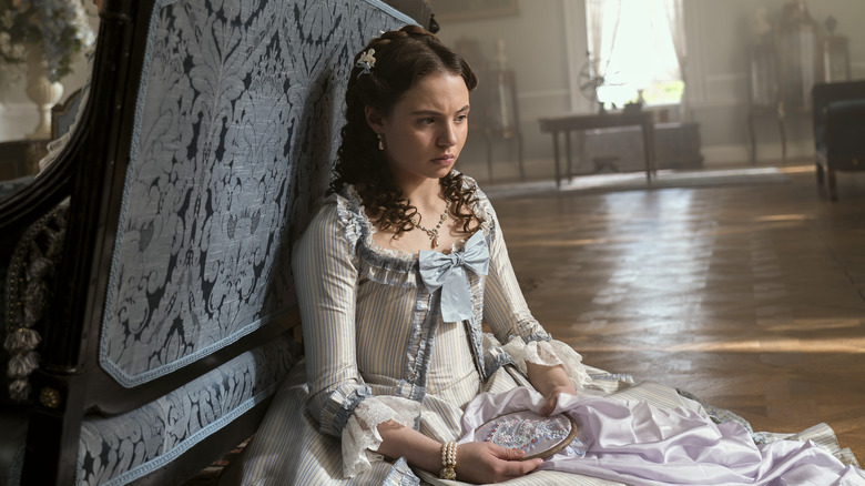 Young Violet sitting on the floor