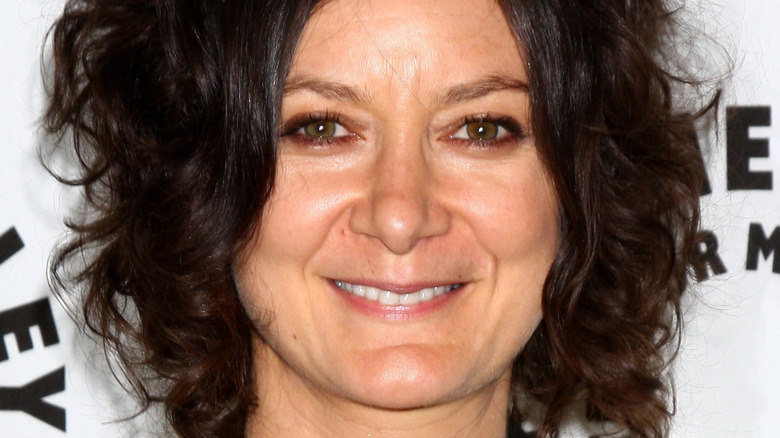 Sara Gilbert poses at an event.