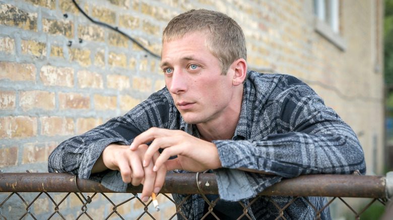 Lip on fence staring