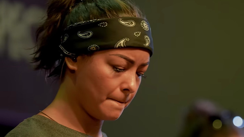 Mica Miller looking down in Death of the Pastor's Wife