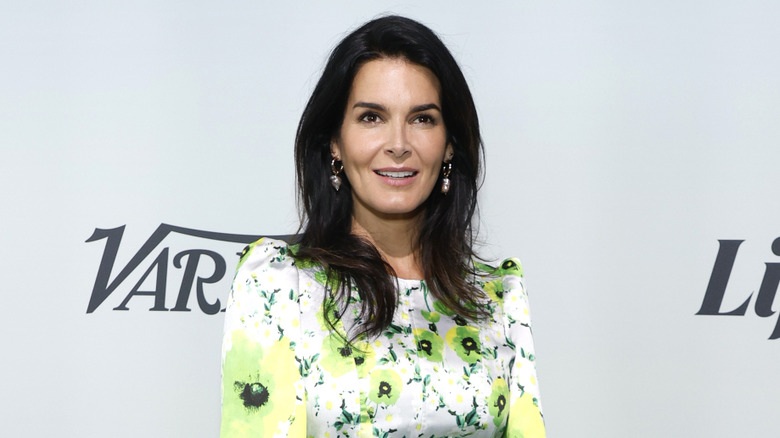 Angie Harmon smiles