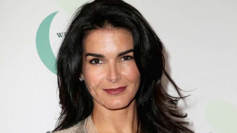 Angie Harmon wearing diamond earrings