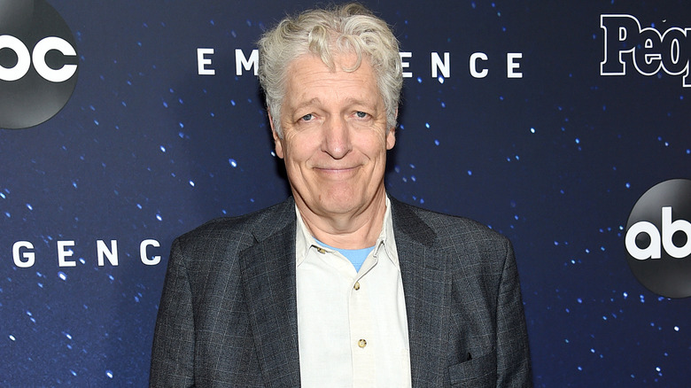 Clancy Brown smiles