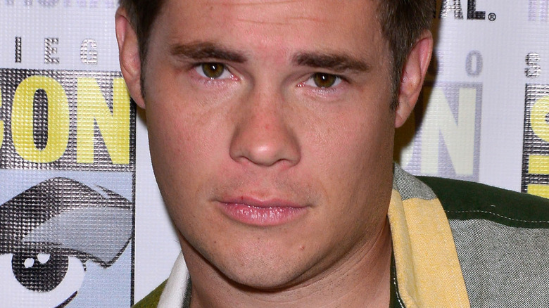 Adam Devine posing at Comic-con