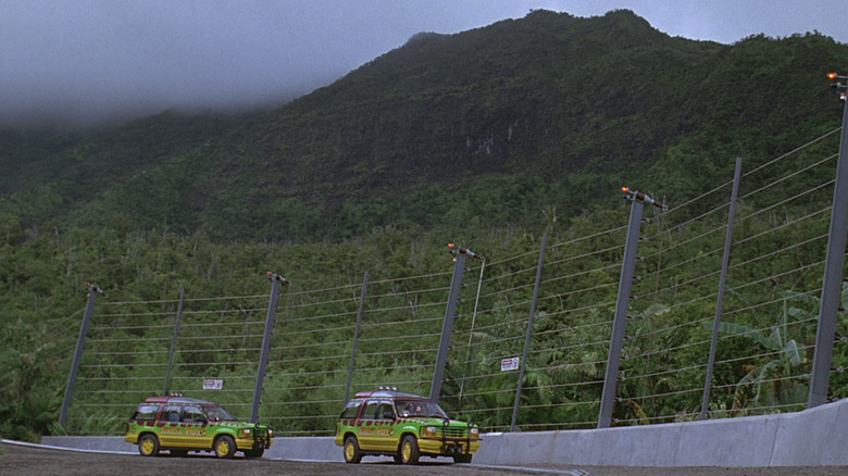 Jeeps passing the T-Rex paddock