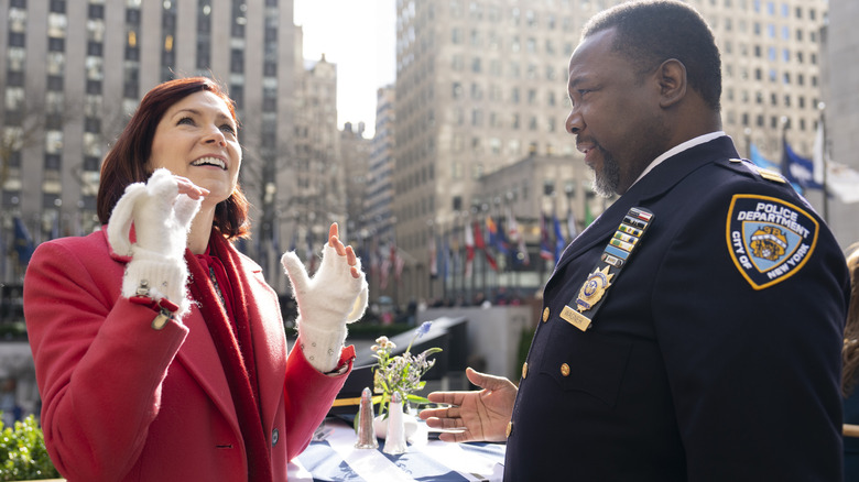 Elsbeth talking with cop