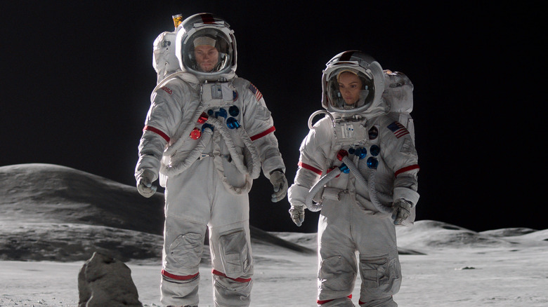 Ed Baldwin and Ellen Wilson wearing space suits on the moon