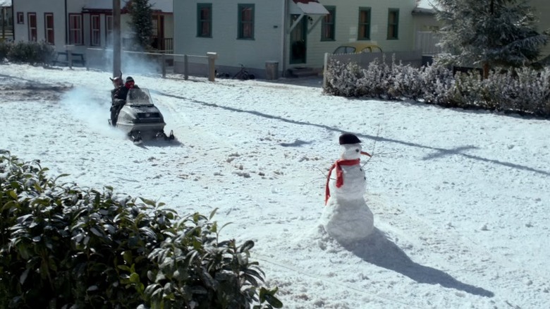 A sled charges towards a snowman in "A Christmas Story Christmas" (2022)