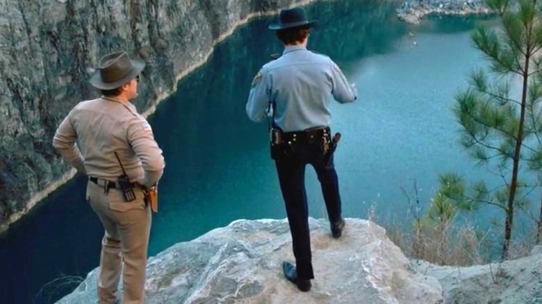Police investigate Sattler's quarry in "Stranger Things" (2016-2025)