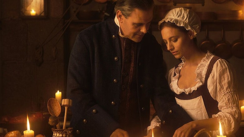 Roberto Enríquez and Michelle Jenner looking down in Cook of Castamar