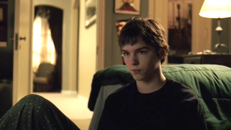 Mike sits quietly in the living room