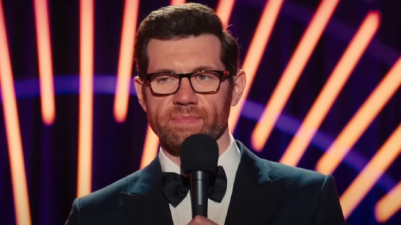 Billy Eichner talks on a microphone