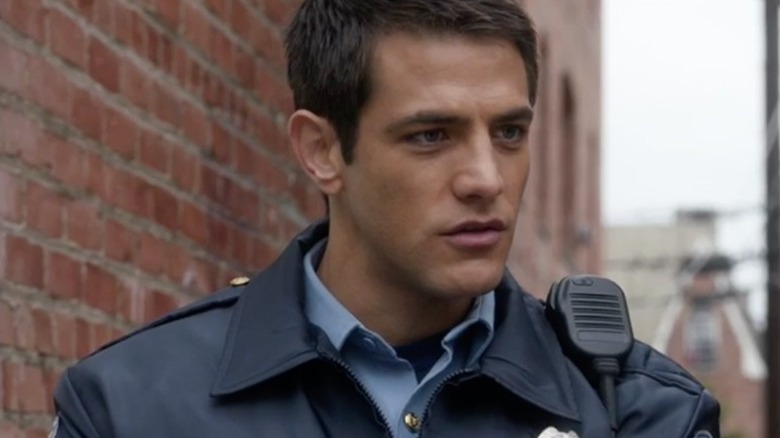 Ryan Tanner wearing police uniform