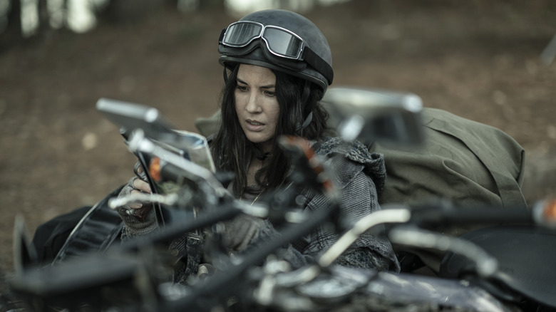 Evie sitting on motorcycle