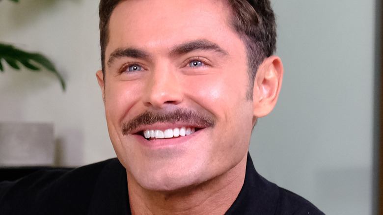 Zac Efron grinning