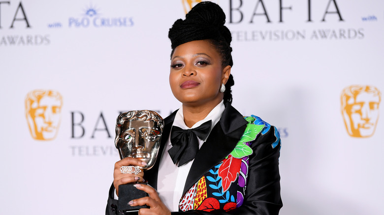 British actor and creator Gbemisola Ikumelo posing at the BAFTA awards with her BAFTA statue