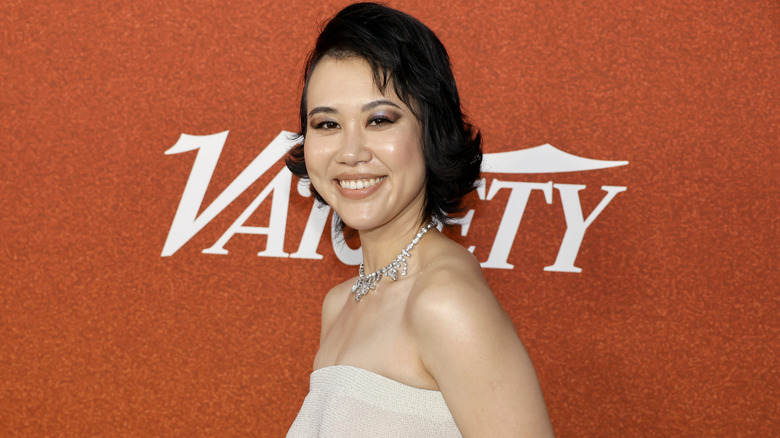 Actress Ramona Young standing in front of an orange wall with a white "Variety" logo