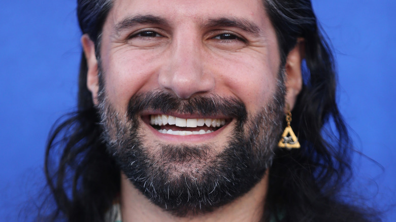 Kayvan Novak smiling wide