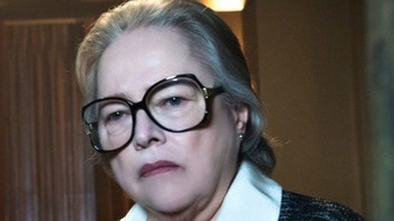 Kathy Bates looks on