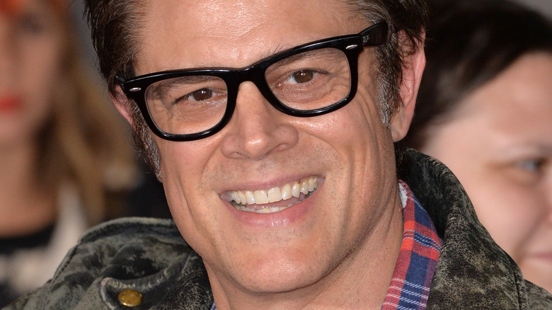 Johnny Knoxville smiling and waving