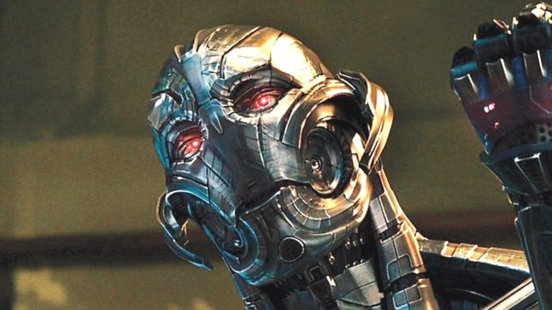 Ultron with red eyes raising fist