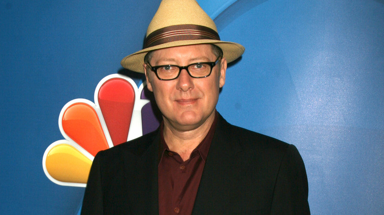 James Spader wearing hat on red carpet