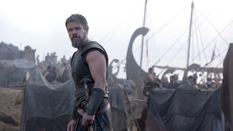 Odysseus in front of a ship in "The Odyssey" (2026)