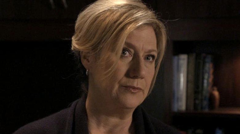 Erin Strauss in front of bookshelf