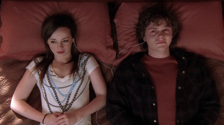 Jack Daniels and Sam Walker listening to music together in bed