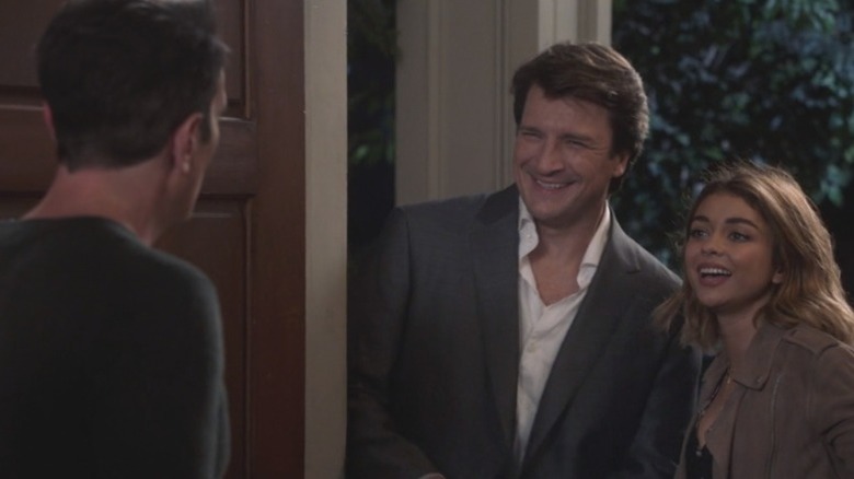 Rainer and Hayley smiling at Phil