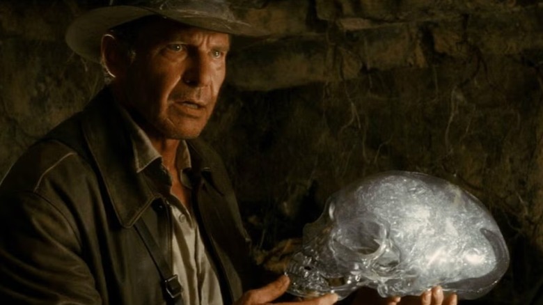 Indiana Jones holding a crystal skull