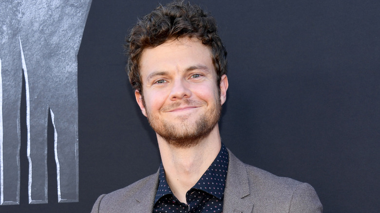 Jack Quaid smiling