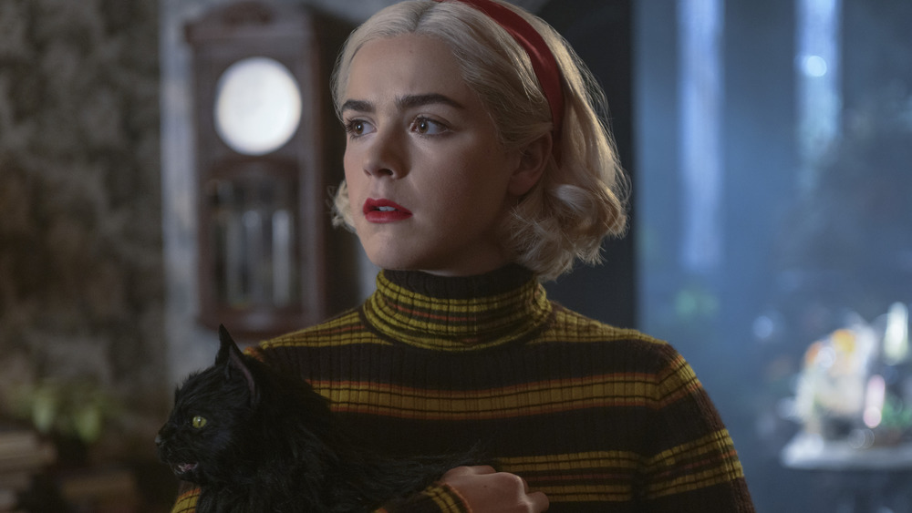 Sabrina Spellman holding Salem