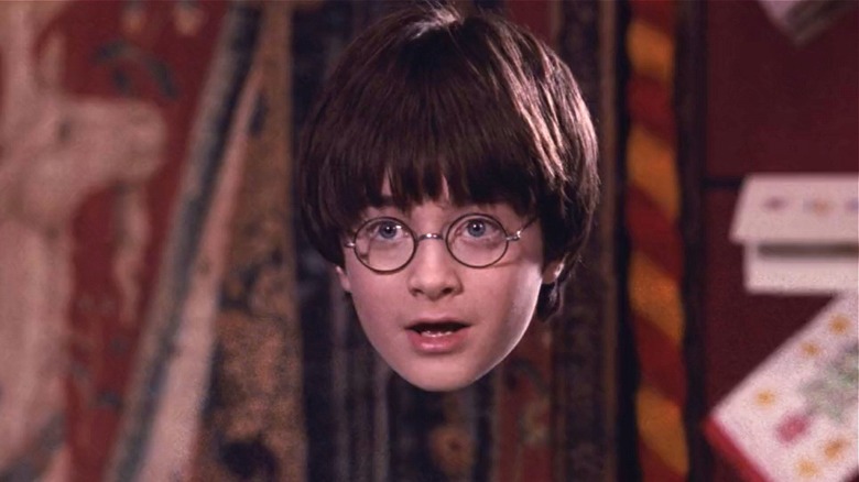 Harry Potter wearing the Invisibility Cloak