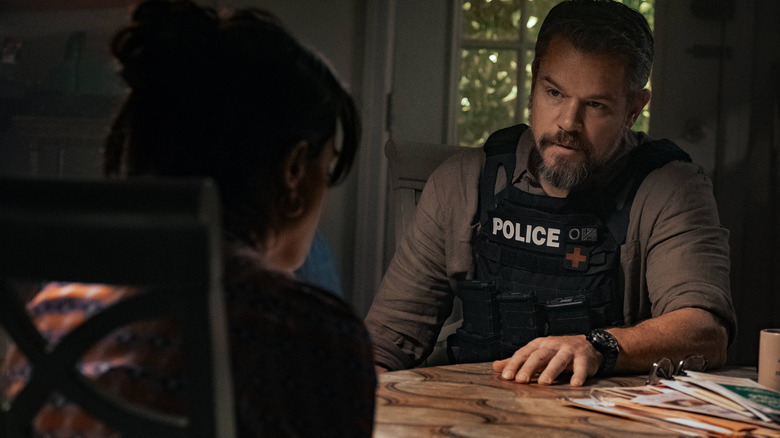 Dane speaking with Desi in 