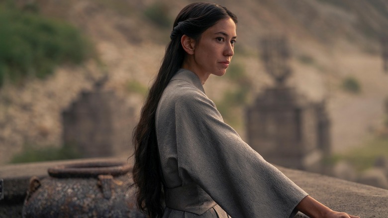 Mysaria with her hair long in a gray cloak on House of the Dragon