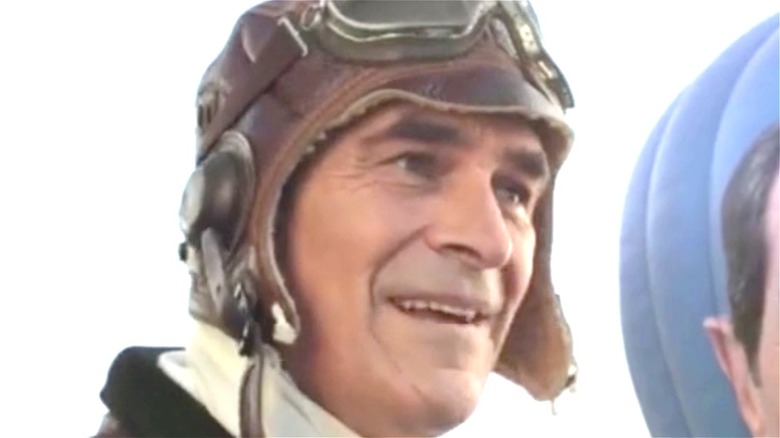 Ty Burrell smiling in an aviator cap