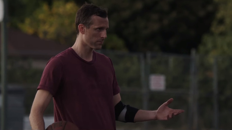 Tom playing basketball