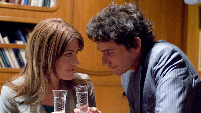 Deb and Rudy share a toast in "Dexter" (2006)