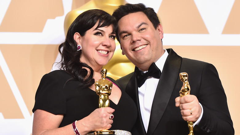 Robert and Kristen holding Oscars