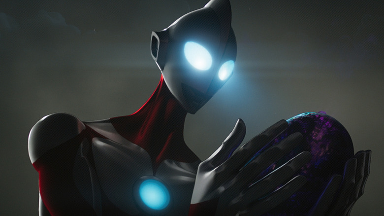 Ultraman holding a kaiju egg