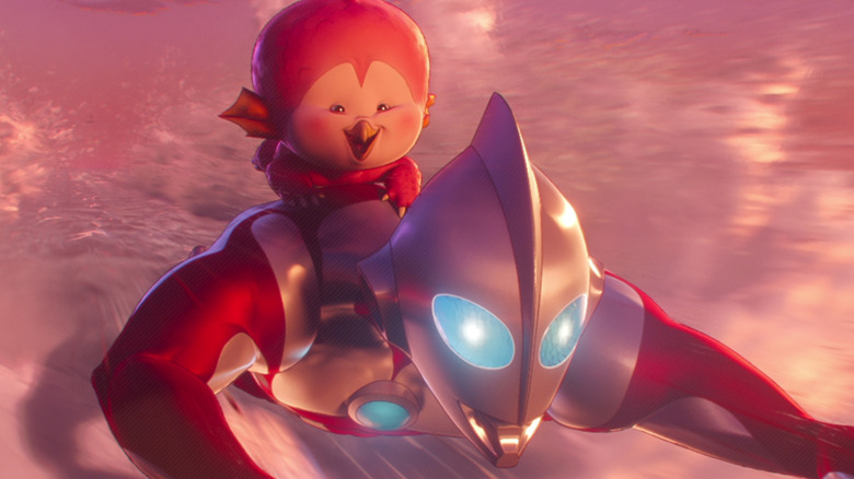 Ultraman flying with baby kaiju