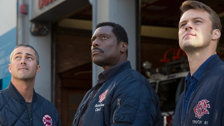Matt Casey, Kelly Severide, and Chief Boden looking up