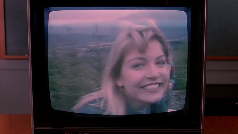 Laura Palmer smiling on a TV screen in Twin Peaks