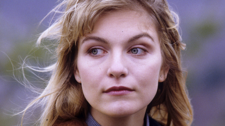Laura Palmer stares into the distance in Twin Peaks